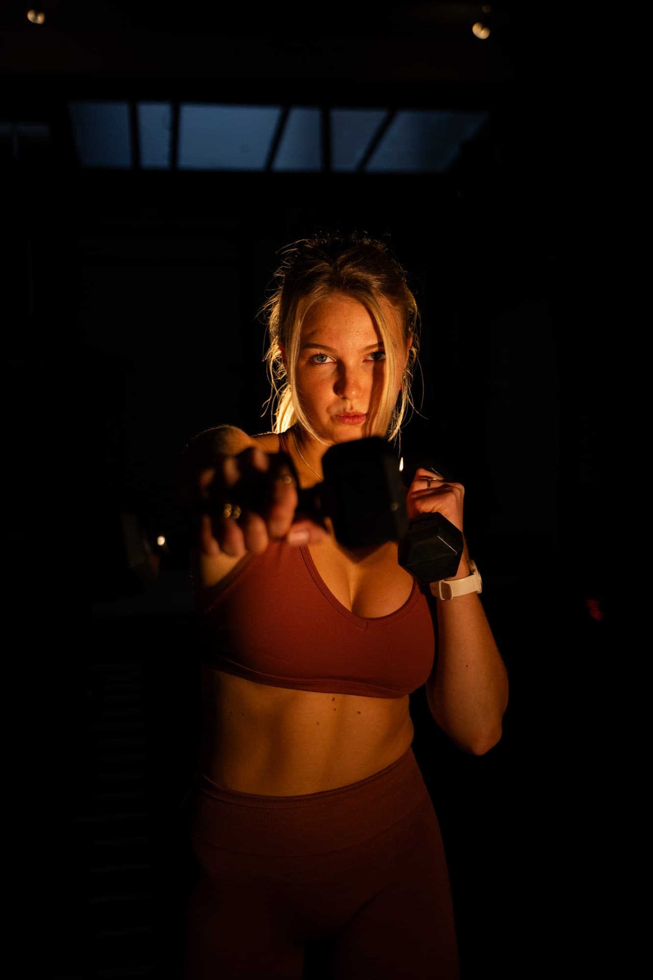 Focused dumbbell training at SculptClub